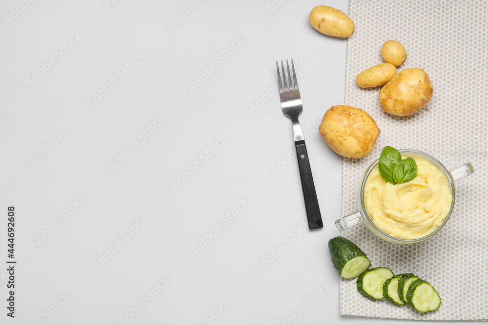 Composition with tasty mashed potatoes on light background