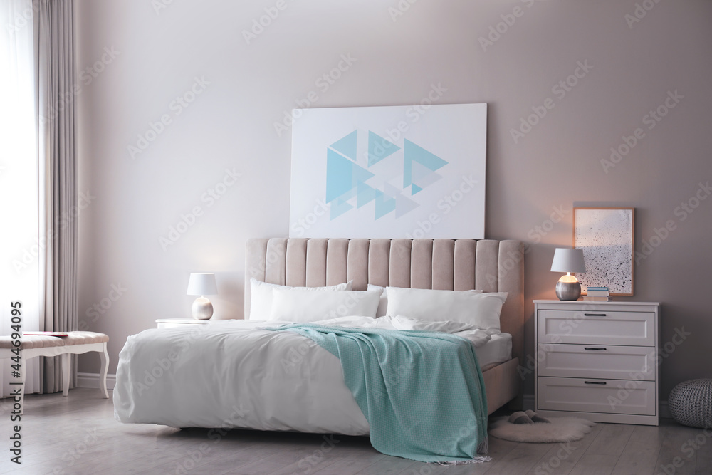 Cozy bed with soft linens in light room - obrazy, fototapety, plakaty 