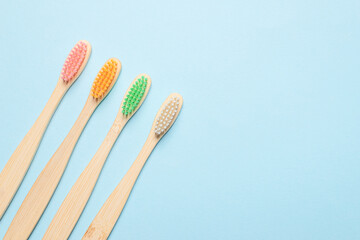 Bamboo toothbrush on a blue background.