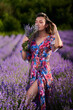 © Xalanx - Young woman in a lavender field at sunset