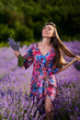 © Xalanx - Young woman in a lavender field at sunset