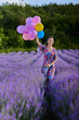 © Xalanx - Woman with balloons in a lavender field