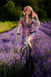 © Xalanx - Young woman riding her bicycle in a lavender field
