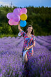© Xalanx - Woman with balloons in a lavender field