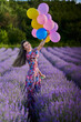 © Xalanx - Woman with balloons in a lavender field