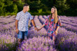 © Xalanx - Young couple holding hands in a lavender field