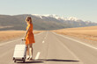 sexy girl in dress with suitcase on the highway, summer travel freedom, woman tourist