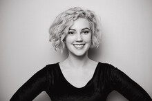 Headshot Of Gorgeous Attractive Young Lady With Curly Hair Smiling. Black And White Picture. Marilyn Monroe.