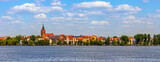 Fototapeta  - Panorama of Elk historic city center with Holiest Heart of Jesus neo-gothic church tower on shore of Jezioro Elckie lake in Masuria region in Poland