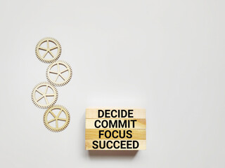 Wall Mural - Inspirational and Motivational Concept - decide commit focus succeed text background. Stock photo.