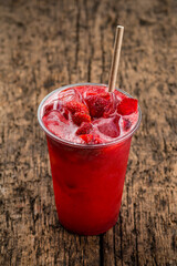 Poster - Refreshing cool lemonade with strawberries and ice in plastic glass