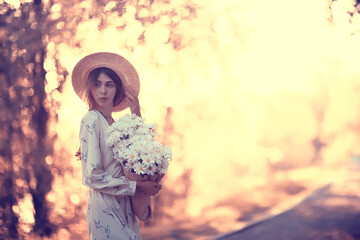 Wall Mural - girl in a straw hat portrait spring freedom / concept spring view model happy people