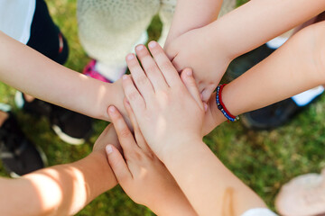 Group of young people's hands. Team, teamwork, unity and friendship concept.