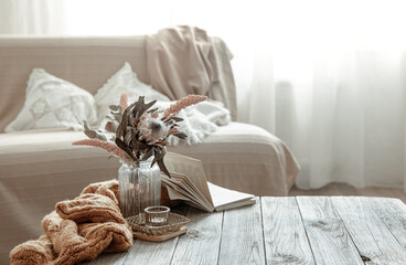 Cozy home still life with a book and decorative elements.