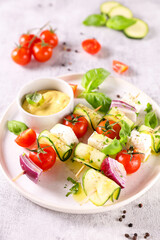 Wall Mural - vegetarian salad with zucchini, tomato and basil