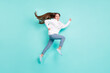 © deagreez - Full length body size view of lovely cheerful successful girl jumping running isolated over bright teal turquoise color background