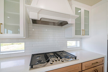 Wall Mural - White kitchen counter with built-in gas cooktop with griddle in stainless steel