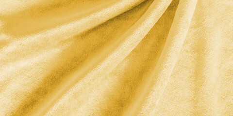 Wall Mural - Gold velvet background or golden yellow velour flannel texture made of cotton or wool with soft fluffy velvety satin fabric cloth metallic color material