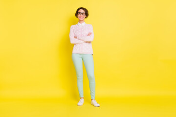 Sticker - Full size photo of positive lovely young woman crossed arms confident stand isolated on vivid yellow color background