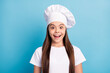 © deagreez - Photo of amazed shocked happy small chef girl wear hat news information isolated on blue color background