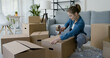 © StockPhotoPro - Woman packing in the living room