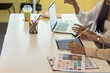 © thatinchan - A team of young designers are discussing and discussing the product styles of the clients they are hiring for design and promotional marketing. promotional product design Concept