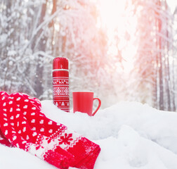 Poster - tea in red thermos in winter forest