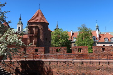 Wall Mural - Old Town in Warsaw, Poland.  Historic Barbican - element of medieval defense construction, an important component of city fortifications