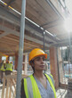 © Paul Bradbury/Caia Image - Portrait thoughtful female construction worker at construction site