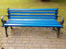 A Blue Wooden Bench In Close-up. Park Bench For Recreation