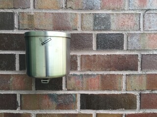 Steel ashtray on the wall 