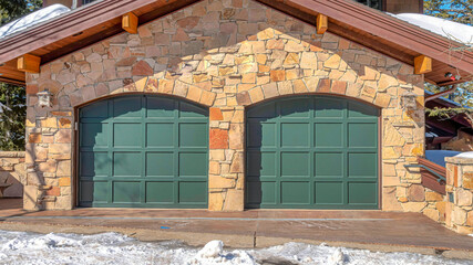 Wall Mural - Pano Lovely facade of home in Park City Utah with two green arched garage doors