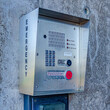 Square Emergency security box with call button mounted on the wall of campus building