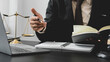 © PaeGAG - Legal counsel presents to the client a signed contract with gavel and legal law. justice and lawyer concept.