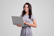 Smiling businesswoman with laptop looking at camera