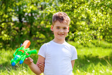 Boy Holding A Water Gun