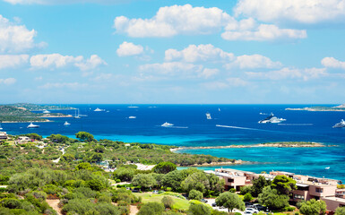 Wall Mural - View from above, stunning view of the Marina of Portisco with beautiful beaches bathed by a turquoise water during a sunny day. Sardinia, Italy