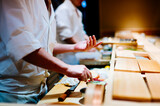 Fototapeta Tęcza - sushi chef hand madecooking