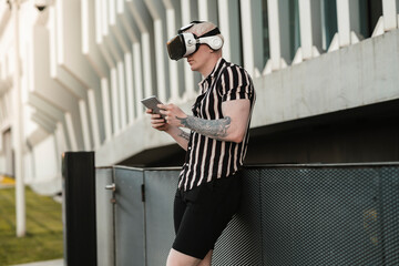 Wall Mural - albino blond man using virtual reality glasses, in the city