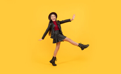 Poster - back to school. tween hurry up. childhood happiness. happy girl in leather wear.