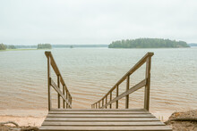 Wooden Stairs To The Seashore. Sandy Beach, Pine Forest. Scandinavian Nature. Finland. Porvoo