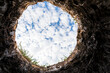 © JJ Gouin - Looking up from hole in yard. Financial debt, underground utility and home construction concept.