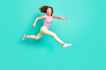 Sticker - Full body profile photo of impressed brown teen girl jump run wear top pants isolated on teal color background