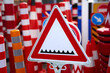 Shop of warning and restrictive road signs. Sign warning about a road blocker with spikes