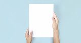 Fototapeta Mapy - Hands holding paper blank for letter paper