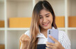 © David - Portrait of smile beautiful business asian woman pink suit working in office desk using smarkphone. Small business sme people employee freelance online start up marketing telemarket successful banner
