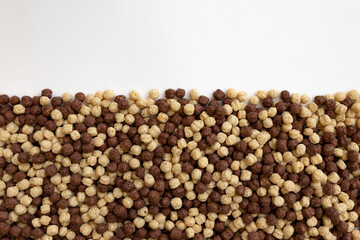 Wall Mural - chocolate breakfast cereal texture, cereal balls as background, top view