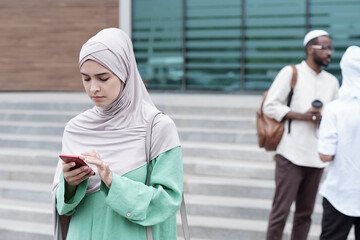 Canvas Print - Muslim Woman Checking Phone