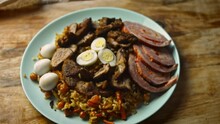 I Put The Uzbek Pilaf On The Plate. Decorate Nicely With Cut Meat. 4k Video