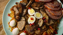 Taste Uzbek Cuisine Soulful Wedding Pilaf. It Is Beautifully Decorated With Eggs And Sausage. 4k Video